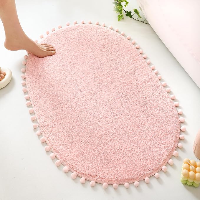 YIRDDEO Oval Rug for Bathroom, Cute Boho Bath Mat with Pom, Blush | Soft Plush, Absorbent, Quick Dry, Machine Washable, Non Slip Bath Mat for Bathroom Shower Floor Home Decor
