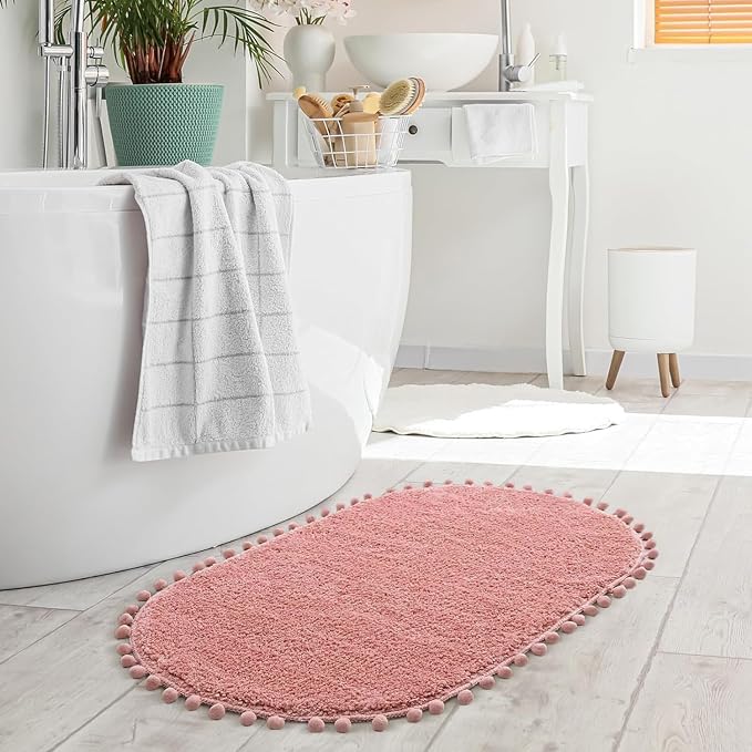 YIRDDEO Oval Rug for Bathroom, Cute Boho Bath Mat with Pom, Dusty Pink | Soft Plush, Absorbent, Quick Dry, Machine Washable, Non Slip Bath Mat for Bathroom Shower Floor Home Decor