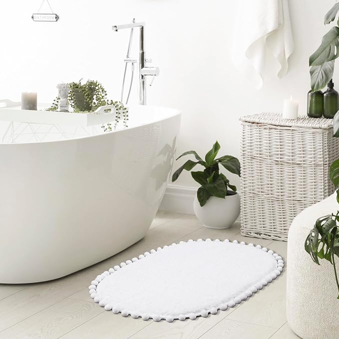 YIRDDEO Oval Rug for Bathroom, Cute Boho Bath Mat with Pom, White | Soft Plush, Absorbent, Quick Dry, Machine Washable, Non Slip Bath Mat for Bathroom Shower Floor Home Decor