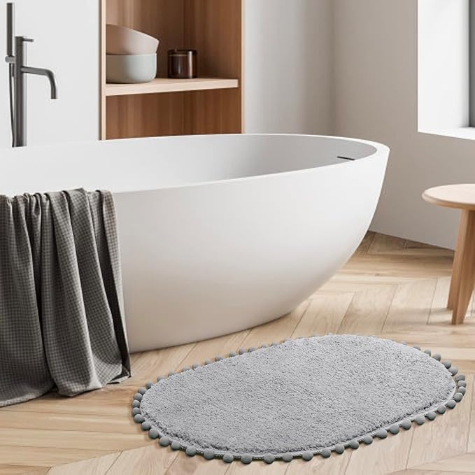 YIRDDEO Oval Rug for Bathroom, Cute Boho Bath Mat with Pom, Light Grey | Soft Plush, Absorbent, Quick Dry, Machine Washable, Non Slip Bath Mat for Bathroom Shower Floor Home Decor