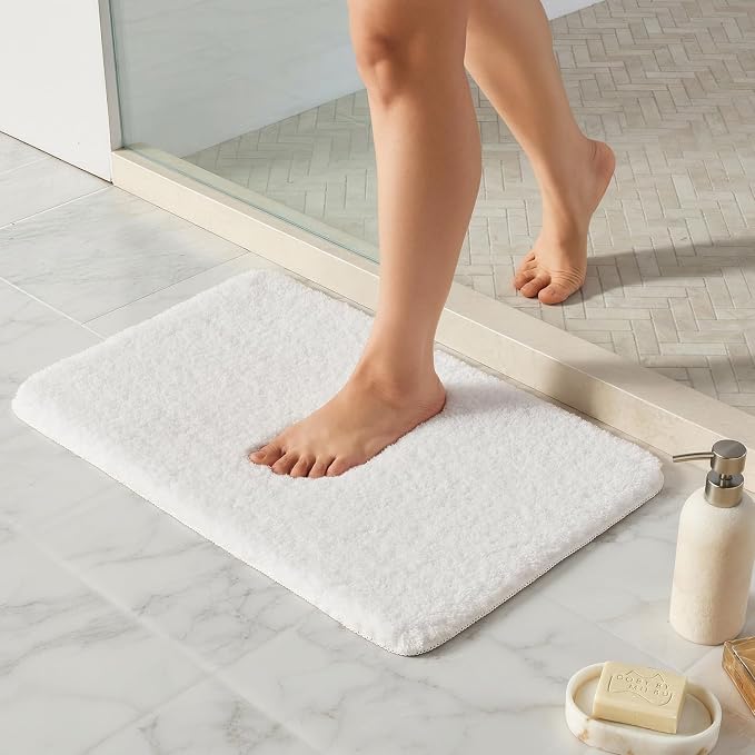 TYUU White Bathroom Rugs, Ultra Soft Bath Rugs Non Slip Washable, Super Absorbent Quick Dry Small Bath Mat with Rubber Backing for Bathroom Floor, Shower, or Sink, White 16" x 24"