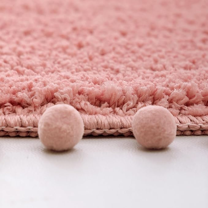 YIRDDEO Oval Rug for Bathroom, Cute Boho Bath Mat with Pom, Dusty Pink | Soft Plush, Absorbent, Quick Dry, Machine Washable, Non Slip Bath Mat for Bathroom Shower Floor Home Decor