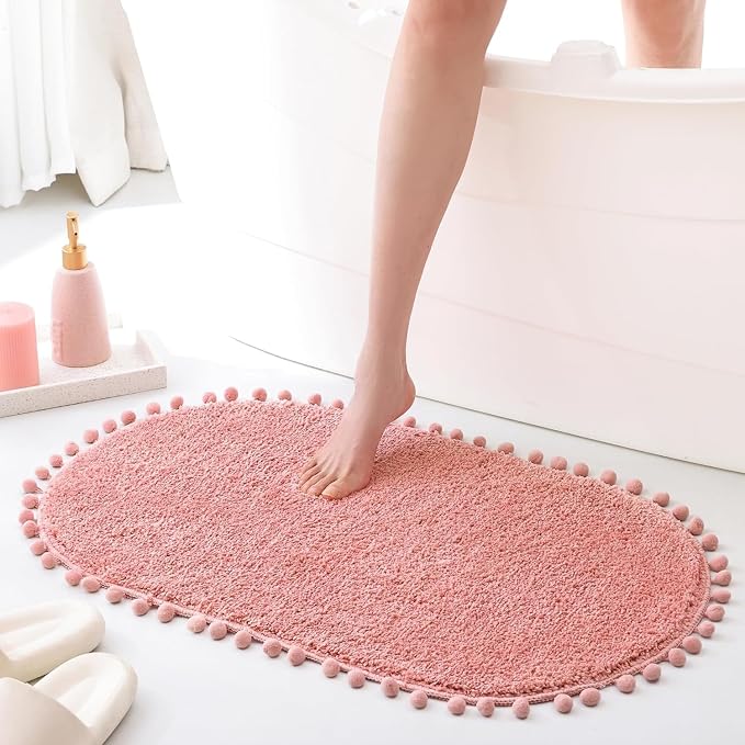YIRDDEO Oval Rug for Bathroom, Cute Boho Bath Mat with Pom, Dusty Pink | Soft Plush, Absorbent, Quick Dry, Machine Washable, Non Slip Bath Mat for Bathroom Shower Floor Home Decor
