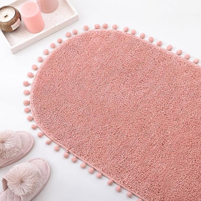 YIRDDEO Oval Rug for Bathroom, Cute Boho Bath Mat with Pom, Dusty Pink | Soft Plush, Absorbent, Quick Dry, Machine Washable, Non Slip Bath Mat for Bathroom Shower Floor Home Decor