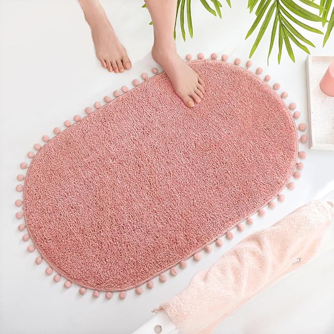 YIRDDEO Oval Rug for Bathroom, Cute Boho Bath Mat with Pom, Dusty Pink | Soft Plush, Absorbent, Quick Dry, Machine Washable, Non Slip Bath Mat for Bathroom Shower Floor Home Decor