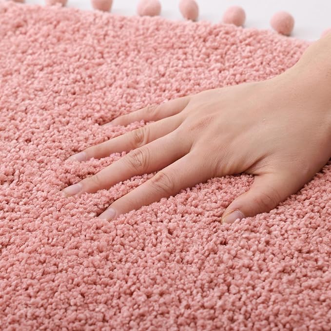 YIRDDEO Oval Rug for Bathroom, Cute Boho Bath Mat with Pom, Dusty Pink | Soft Plush, Absorbent, Quick Dry, Machine Washable, Non Slip Bath Mat for Bathroom Shower Floor Home Decor