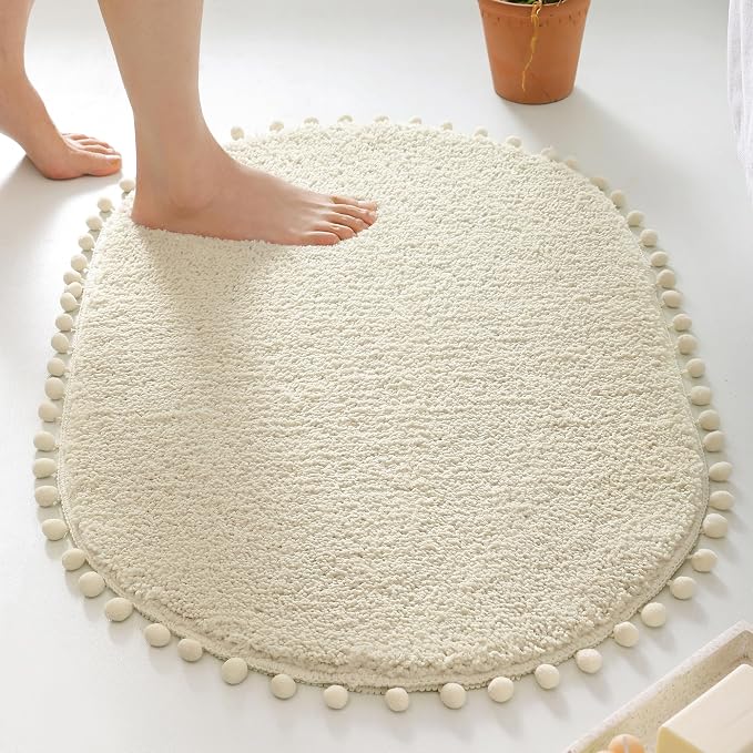 YIRDDEO Oval Rug for Bathroom, Cute Boho Bath Mat with Pom, Cream White | Soft Plush, Absorbent, Quick Dry, Machine Washable, Non Slip Bath Mat for Bathroom Shower Floor Home Decor