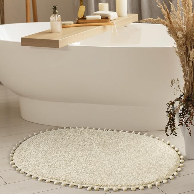 YIRDDEO Oval Rug for Bathroom, Cute Boho Bath Mat with Pom, Cream White | Soft Plush, Absorbent, Quick Dry, Machine Washable, Non Slip Bath Mat for Bathroom Shower Floor Home Decor