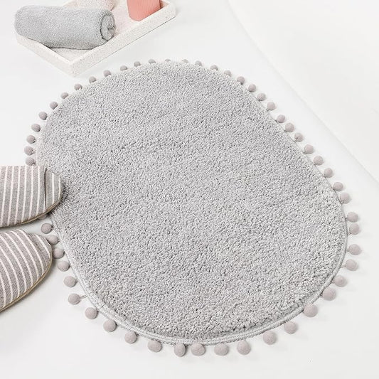 YIRDDEO Oval Rug for Bathroom, Cute Boho Bath Mat with Pom, Light Grey | Soft Plush, Absorbent, Quick Dry, Machine Washable, Non Slip Bath Mat for Bathroom Shower Floor Home Decor