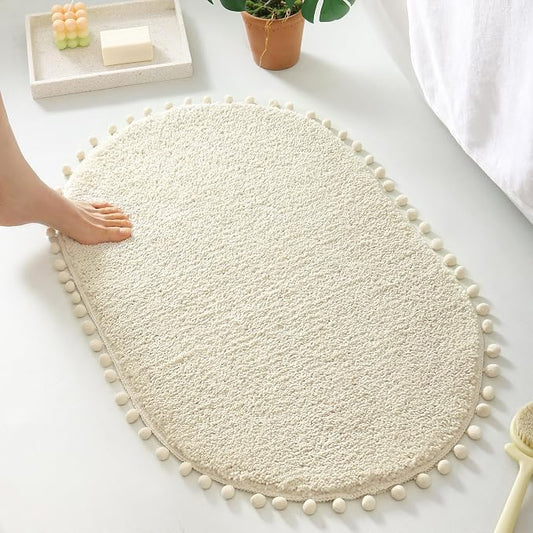 YIRDDEO Oval Rug for Bathroom, Cute Boho Bath Mat with Pom, Cream White | Soft Plush, Absorbent, Quick Dry, Machine Washable, Non Slip Bath Mat for Bathroom Shower Floor Home Decor