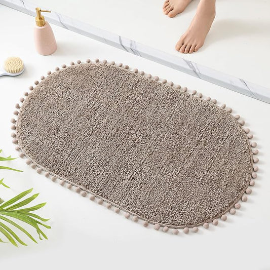 YIRDDEO Oval Rug for Bathroom, Cute Boho Bath Mat with Pom, Oatmeal | Soft Plush, Absorbent, Quick Dry, Machine Washable, Non Slip Bath Mat for Bathroom Shower Floor Home Decor
