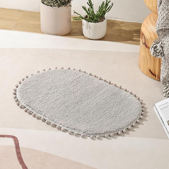 YIRDDEO Oval Rug for Bathroom, Cute Boho Bath Mat with Pom, Light Grey | Soft Plush, Absorbent, Quick Dry, Machine Washable, Non Slip Bath Mat for Bathroom Shower Floor Home Decor